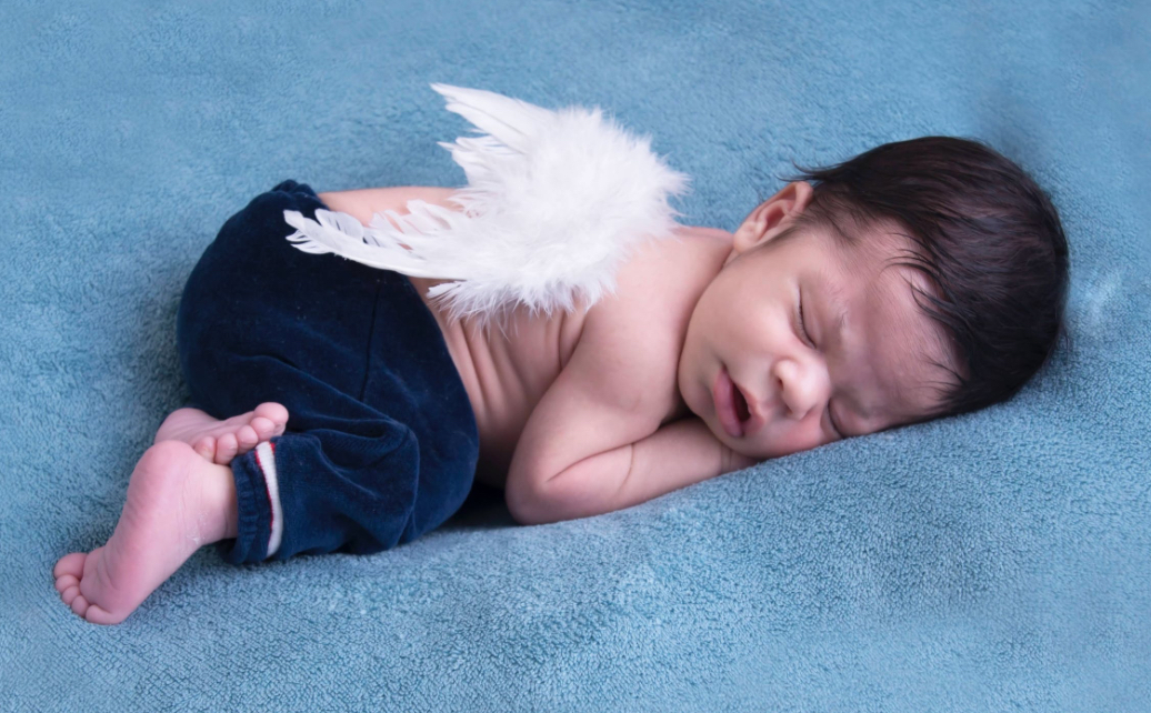 Tiny angel feathers on baby angel